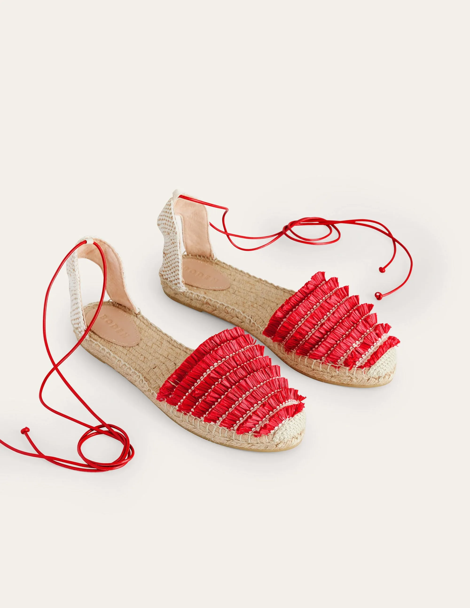 Flache Espadrilles mit Fransen-Zinnoberrot